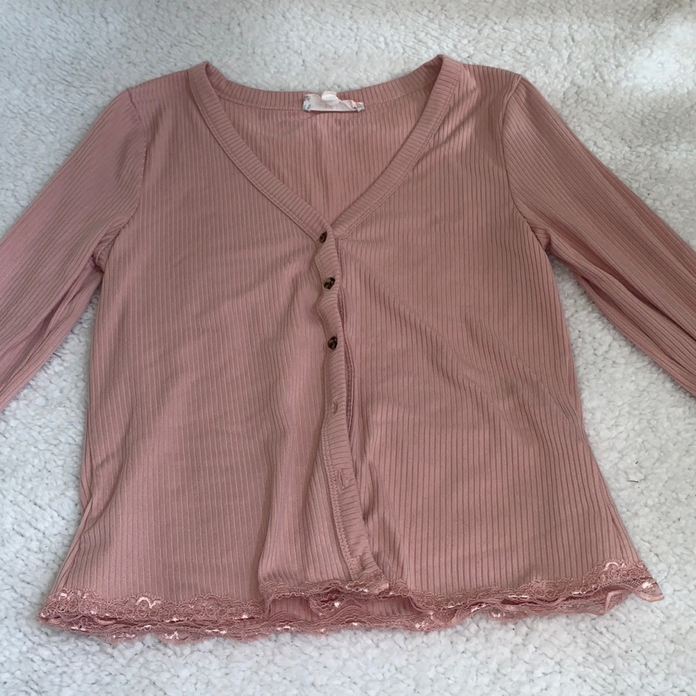 Branded by Pink Rose. Medium in size. The color is a Blush Pink.